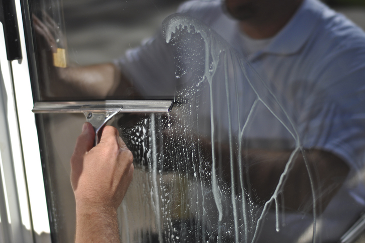 a man cleaning a window